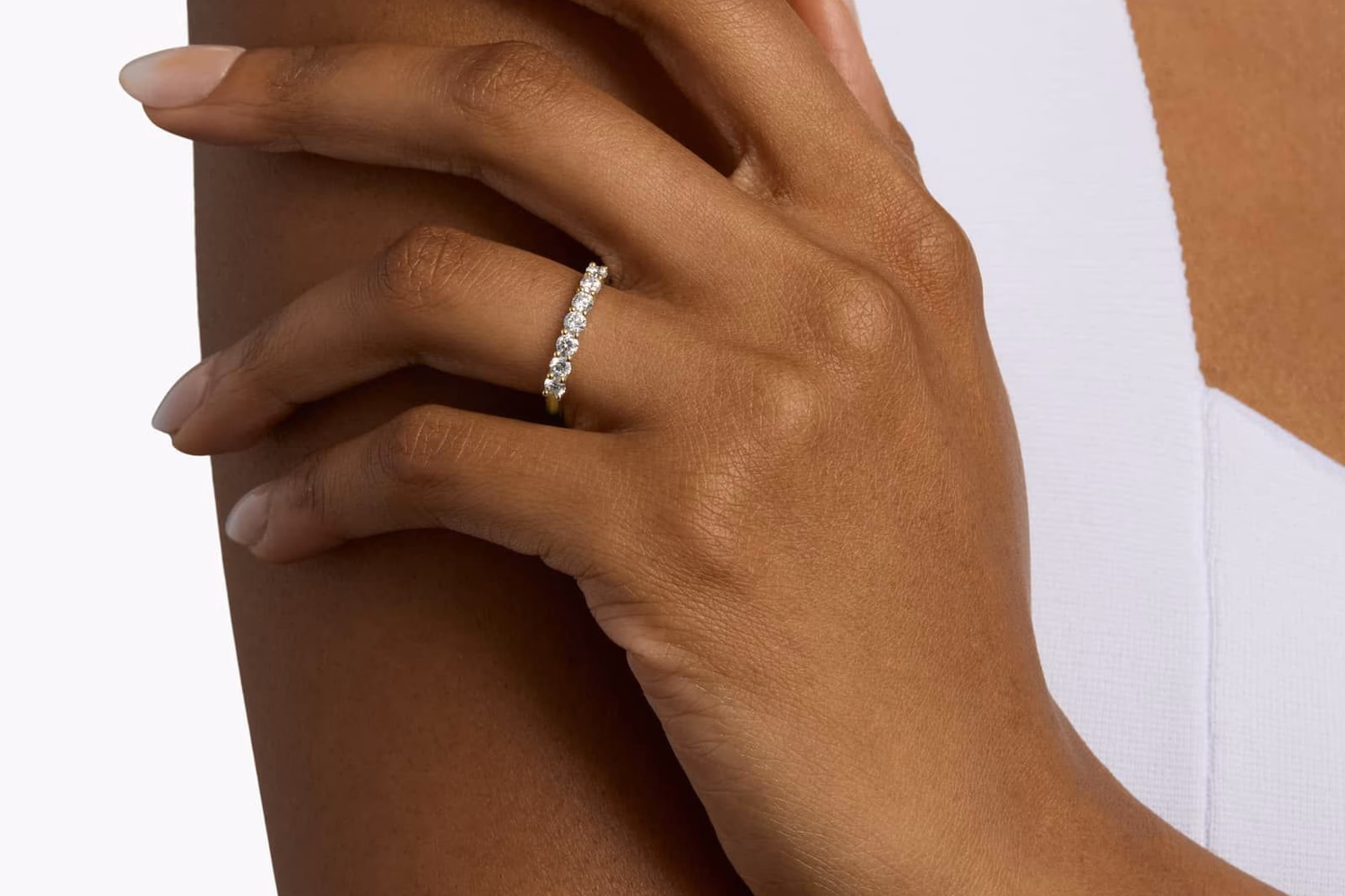 Blue Nile channel set anniversary ring in yellow gold lifestyle