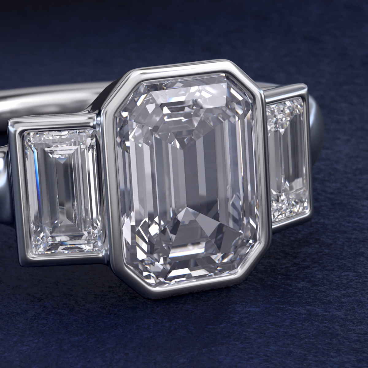 Bezel set emerald cut diamond ring in 14K white gold solitaire setting, overhead view showing the rectangular step-cut stone fully enclosed in a clean metal bezel