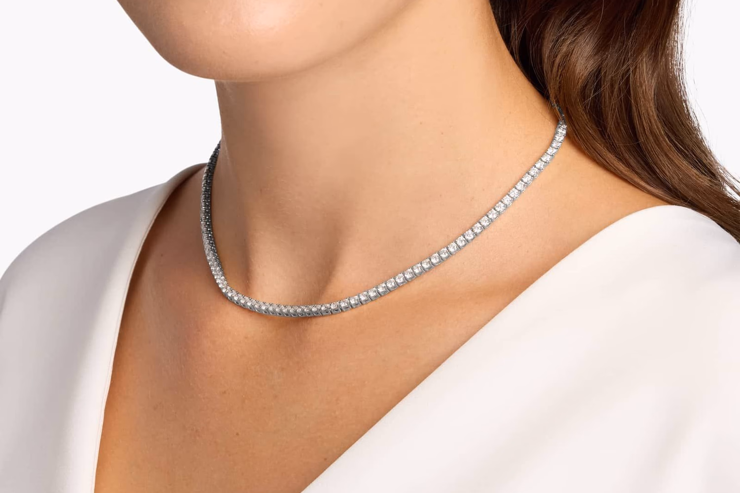 Blue Nile Diamond Tennis Necklace in 14K White Gold — close-up of continuous round diamond eternity necklace worn at collarbone, 16" length