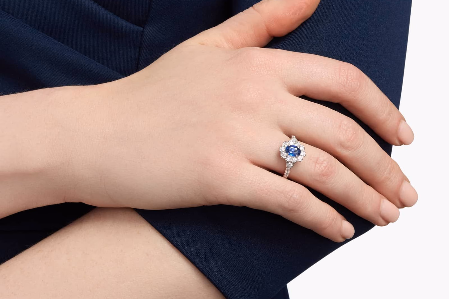 Emerald cut sapphire and diamond ring in platinum