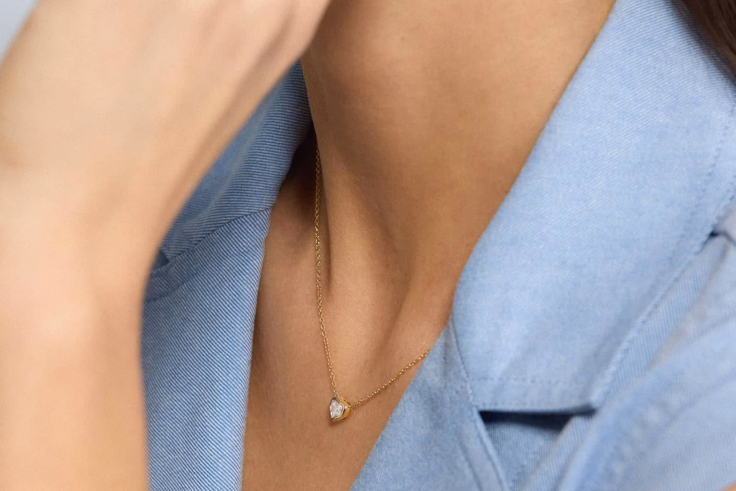 Blue Nile Heart Diamond Pendant Bezel Necklace in 14K Yellow Gold — delicate diamond heart on a fine chain, $3,390
