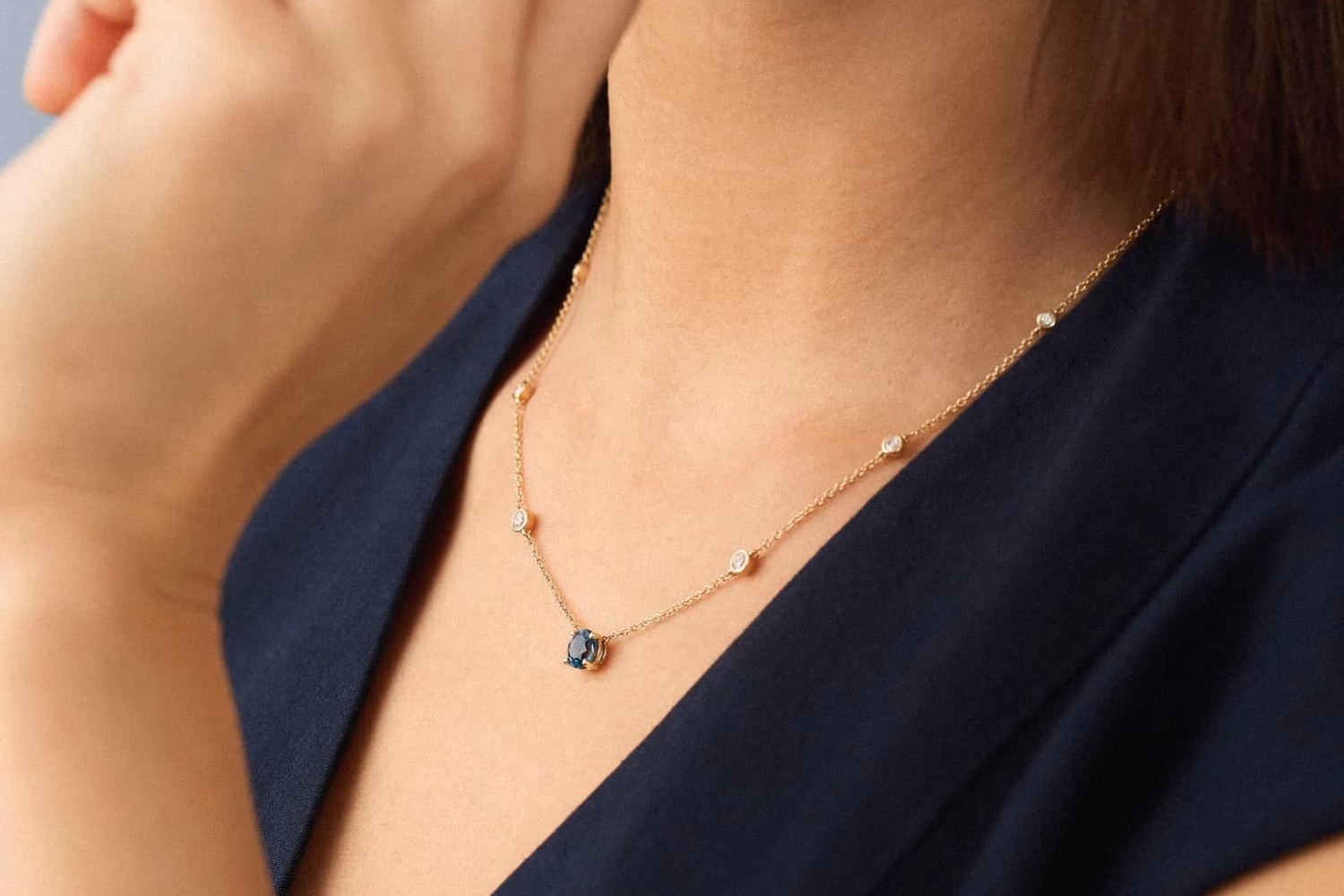 Blue Nile Montana Sapphire and Diamond Station Necklace in 14K Yellow Gold — teal Montana sapphire center with bezel-set round diamond stations, $2,880 on sale