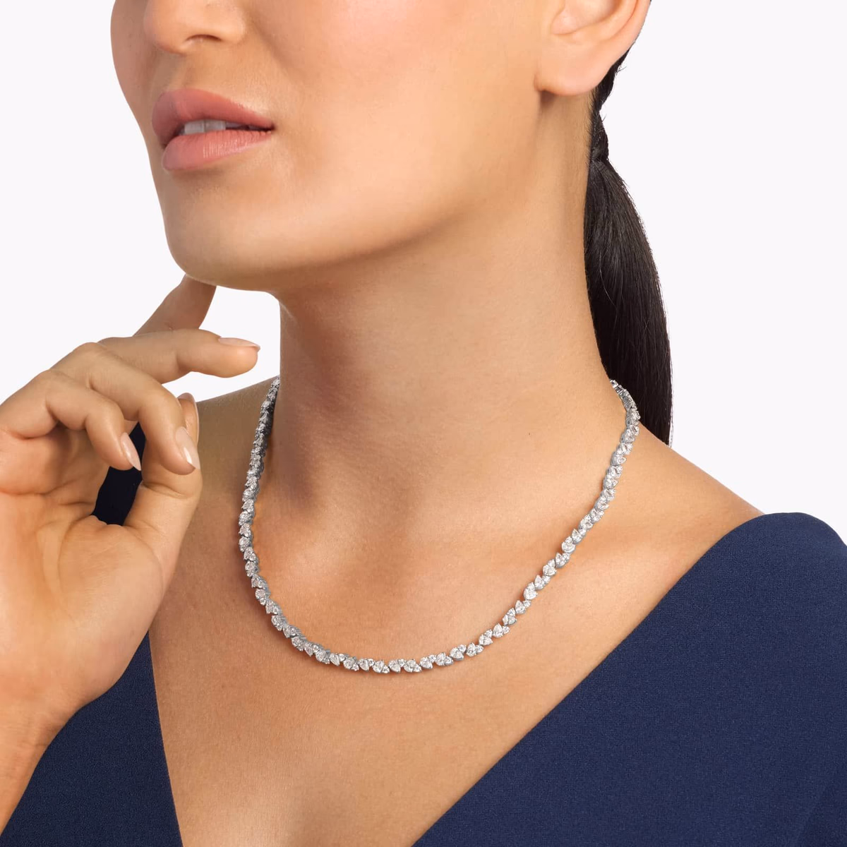 Specialty pear diamond necklace styles — 3 stone drop in yellow gold lifestyle