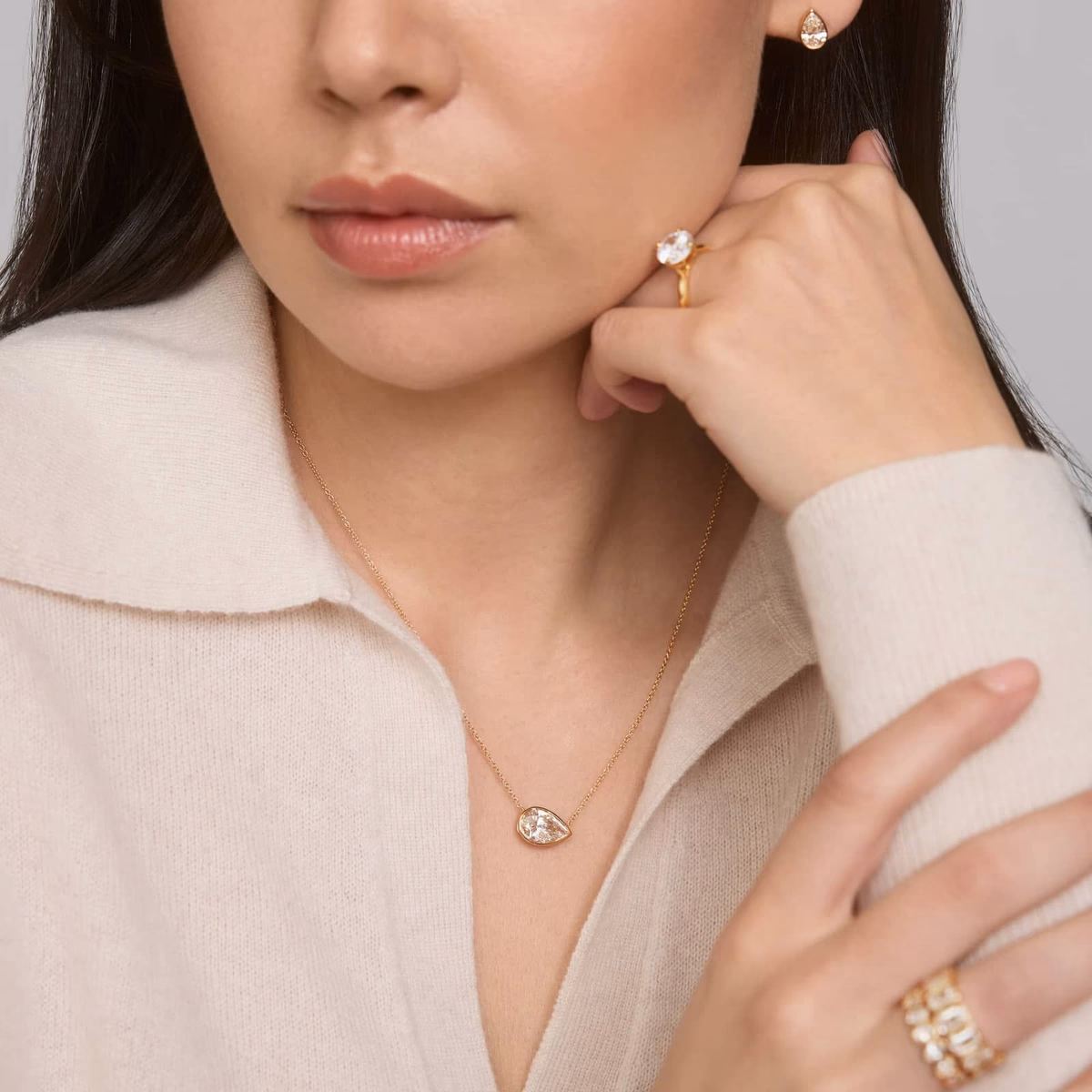 Pear diamond pendant — white gold bezel solitaire lifestyle