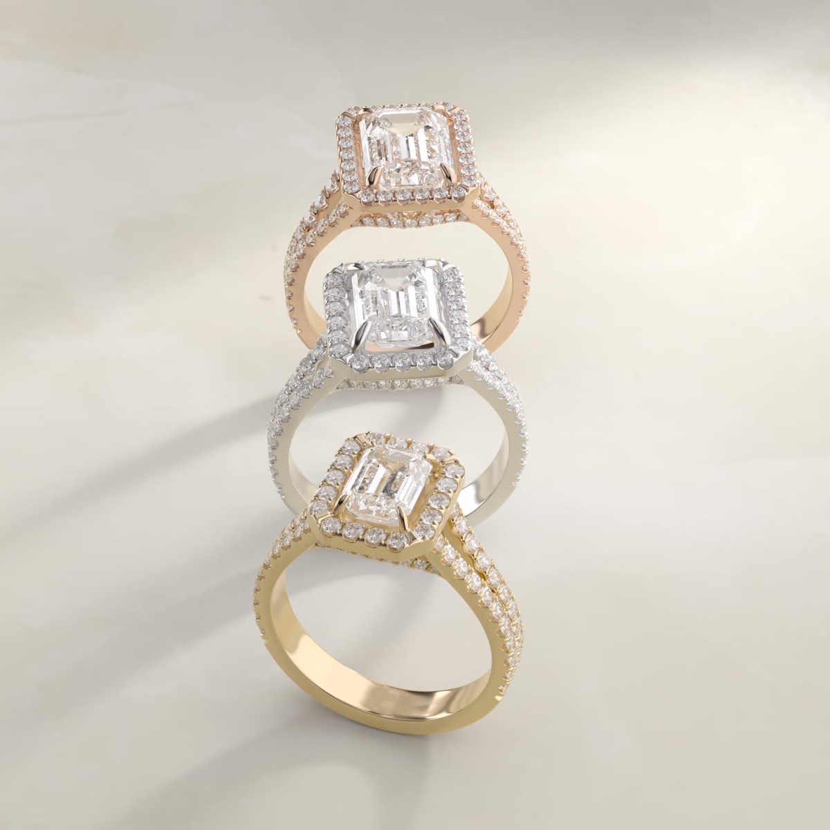 Emerald cut diamond halo engagement ring in white gold — pavé halo setting designed for rectangular step-cut stone
