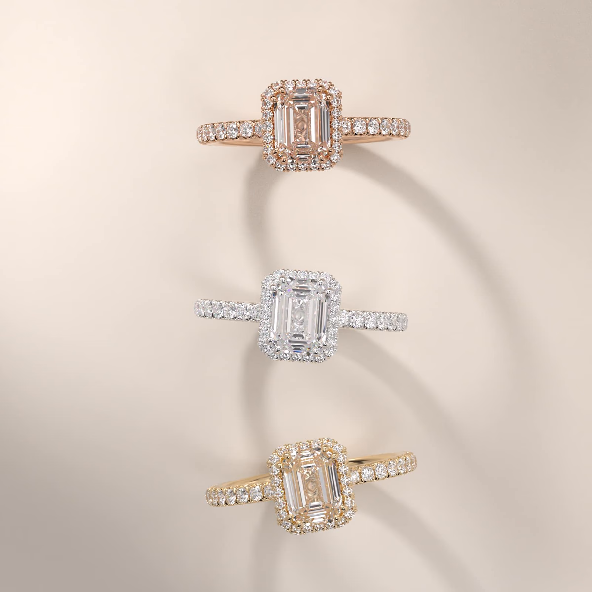 Emerald cut diamond halo ring in white gold pavé — rectangular halo follows the step-cut stone's outline
