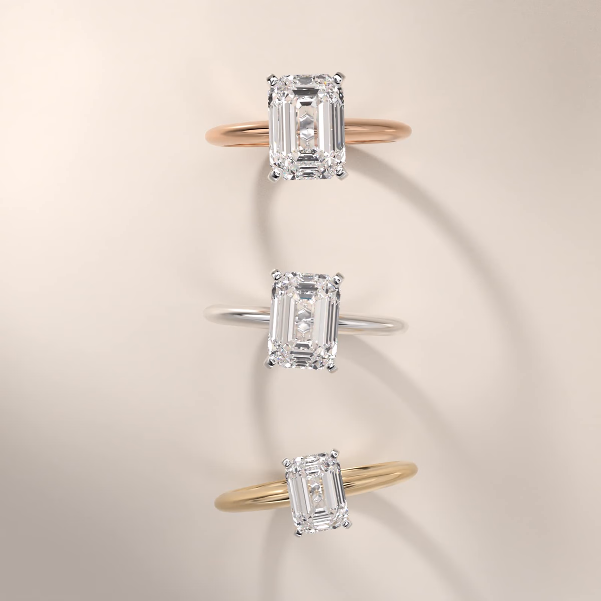Classic emerald cut diamond ring in yellow gold solitaire setting