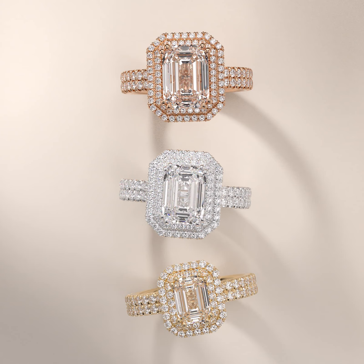 Emerald cut halo engagement ring in yellow gold — cathedral pavé halo setting with elevated center stone