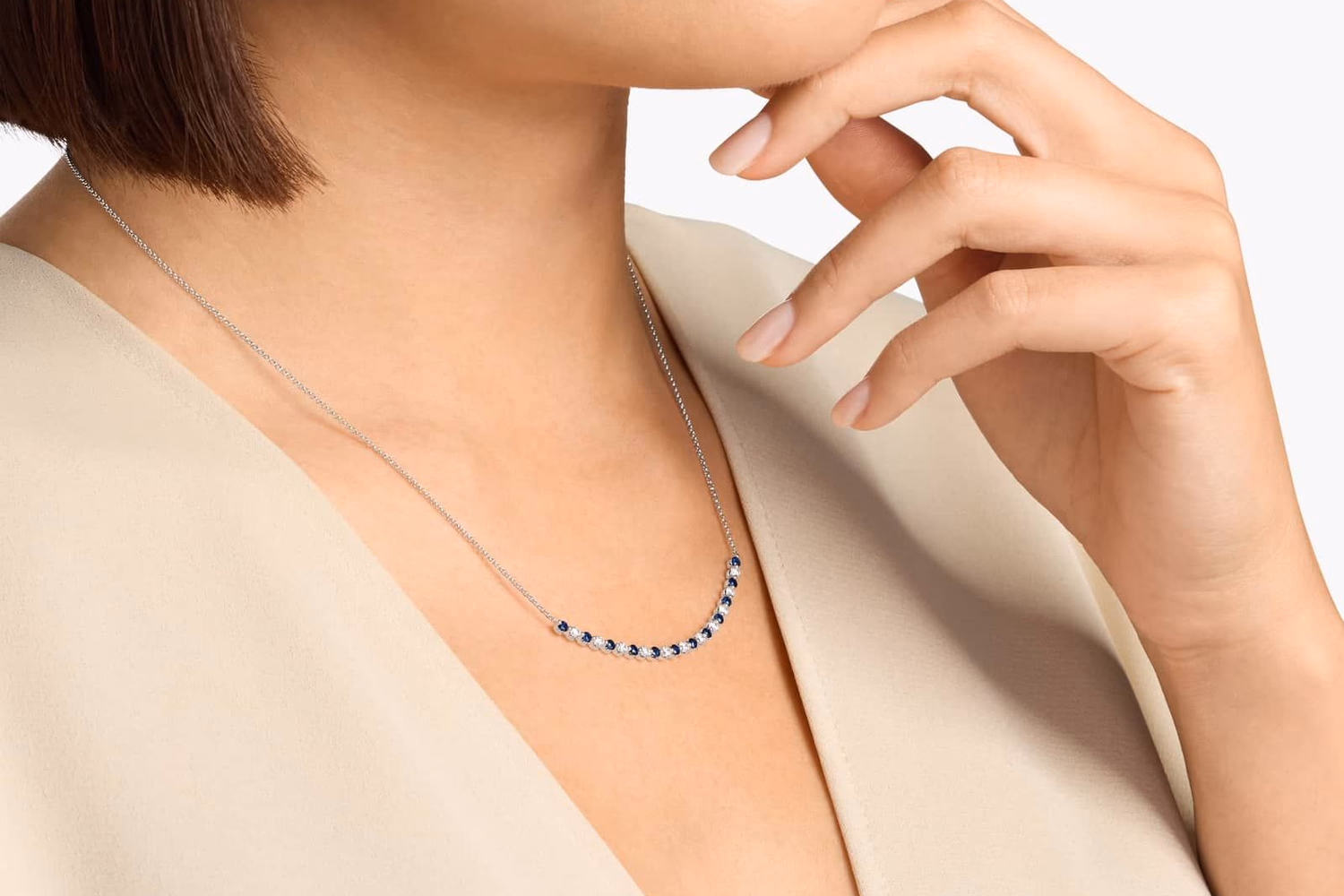 Blue Nile elegant halo gemstone pendant in sterling silver lifestyle photo on model