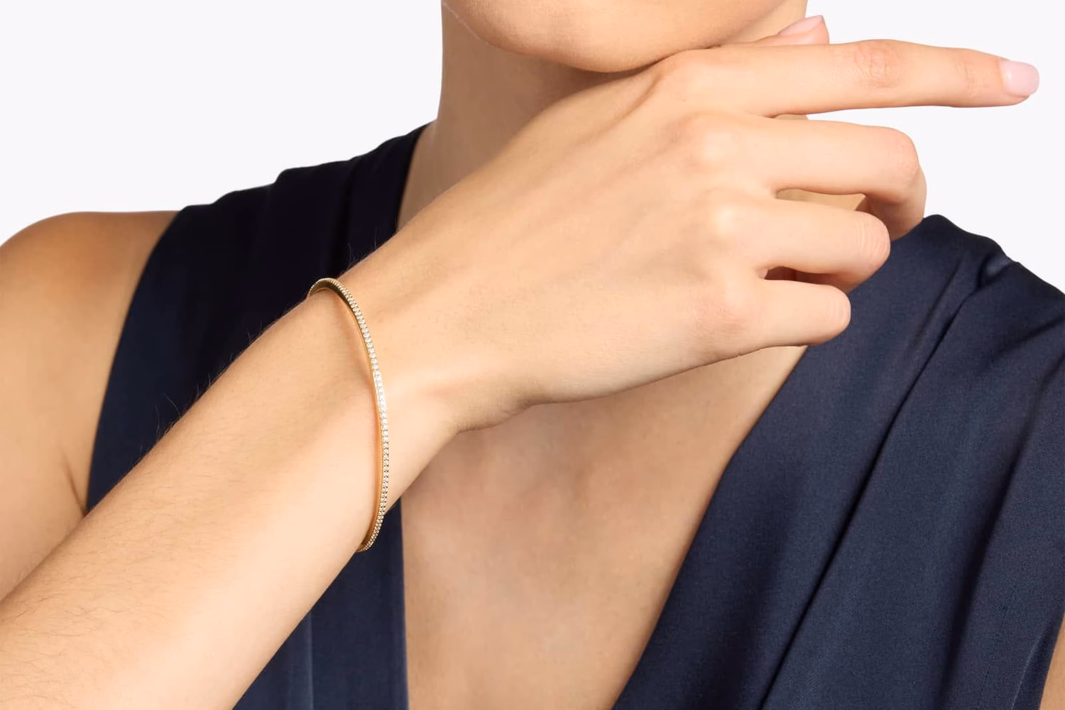 Yellow gold bangle bracelet lifestyle photo, Blue Nile Italian twist bangle on wrist