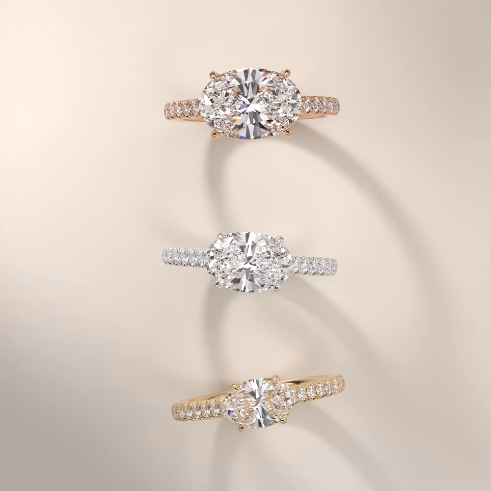 East west oval diamond compass set solitaire ring in white gold