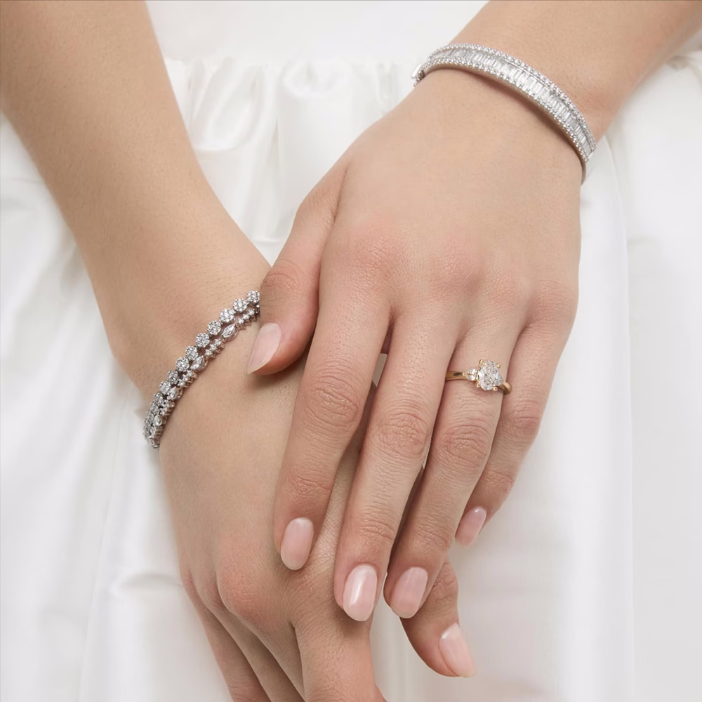 oval diamond three stone ring with baguette side stones