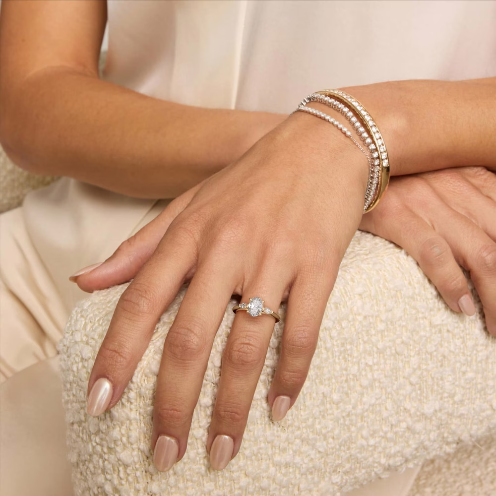 oval diamond three stone ring round pavé