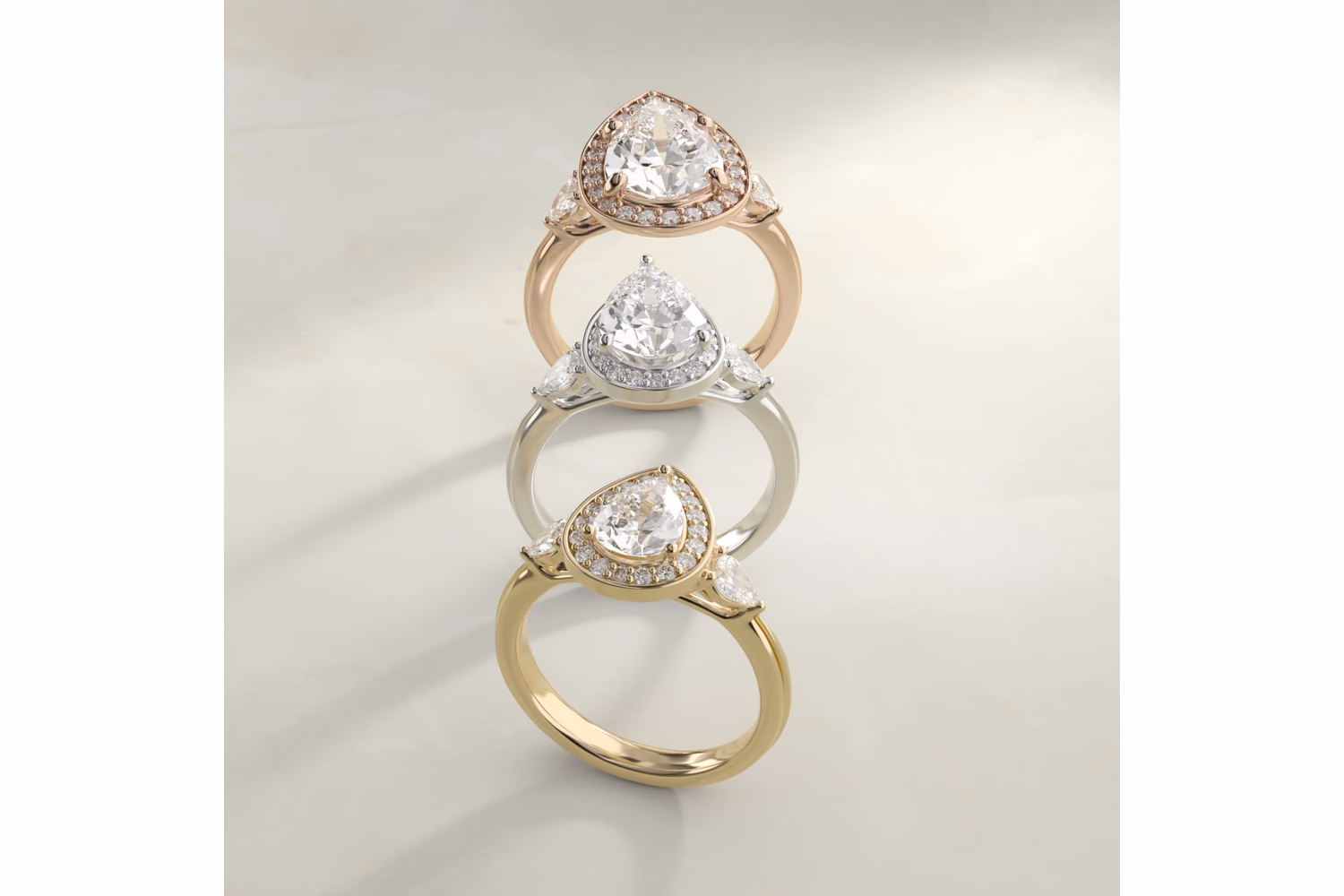 Pear diamond halo ring in white gold — clean pavé accent ring, Diamond Critics