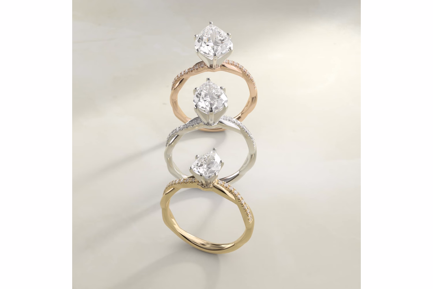Pear shaped diamond ring with pavé setting in white gold — French pavé accent diamonds along the shank