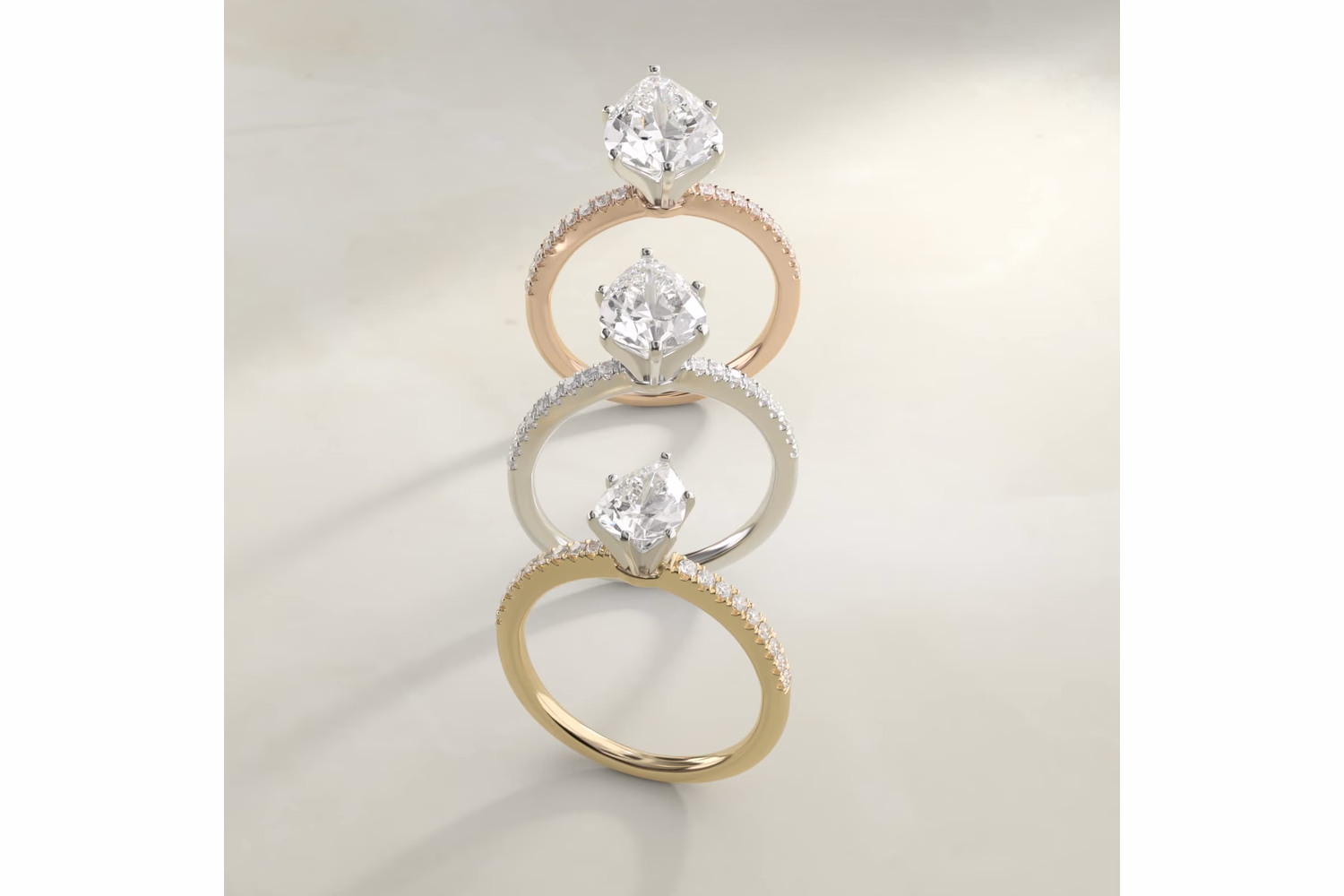 Pear shaped diamond ring in rose gold solitaire setting — warm copper-pink metal with white pear diamond