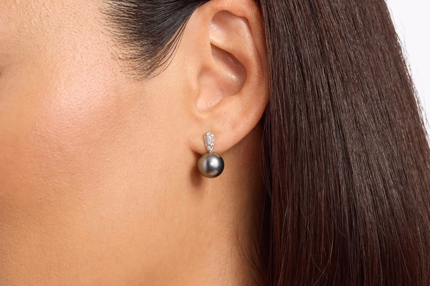 Blue Nile classic Akoya cultured pearl stud earrings in 18K white gold lifestyle photo on model