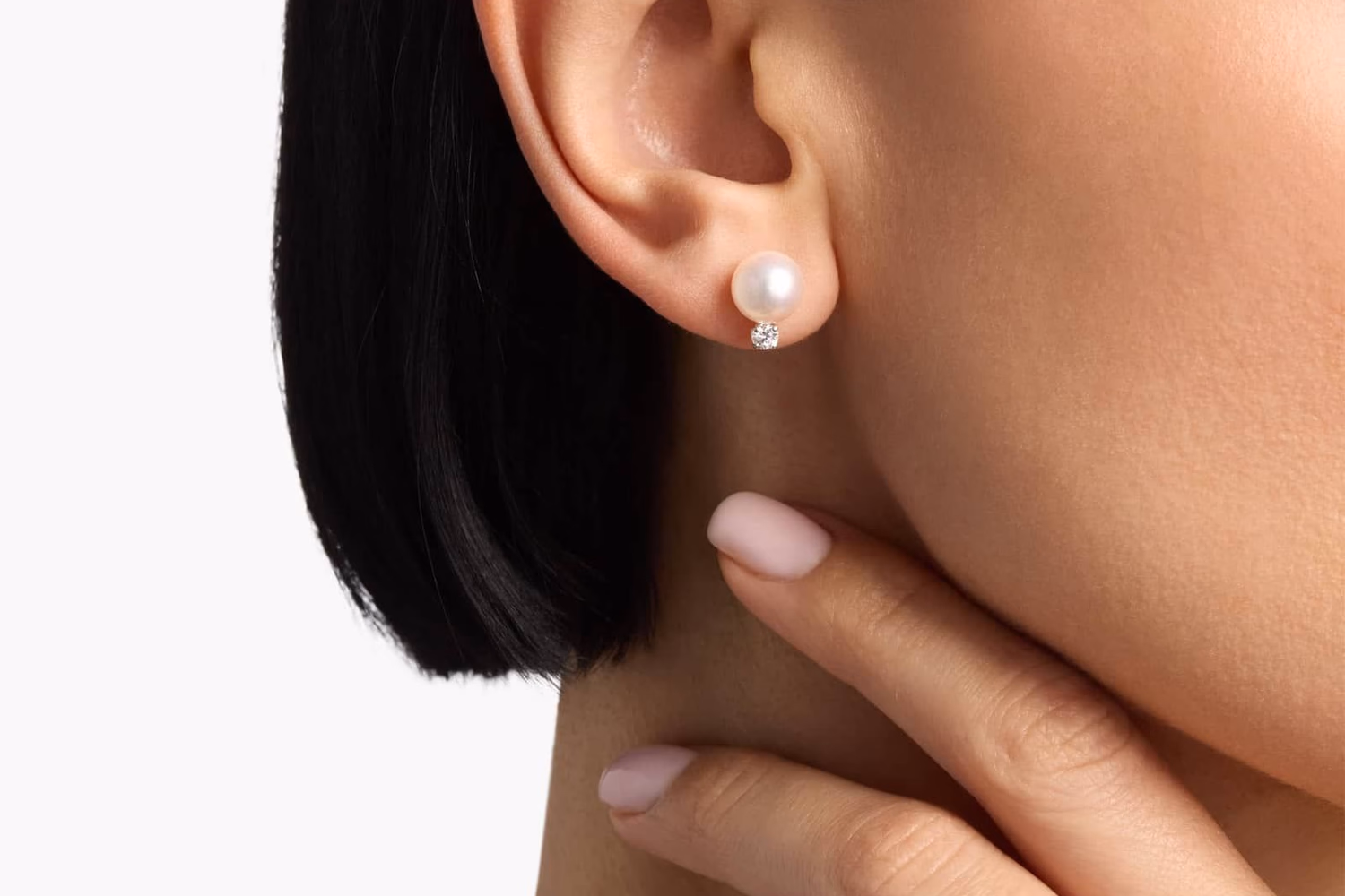 Blue Nile freshwater pearl stud earrings in 14K white gold lifestyle photo on model