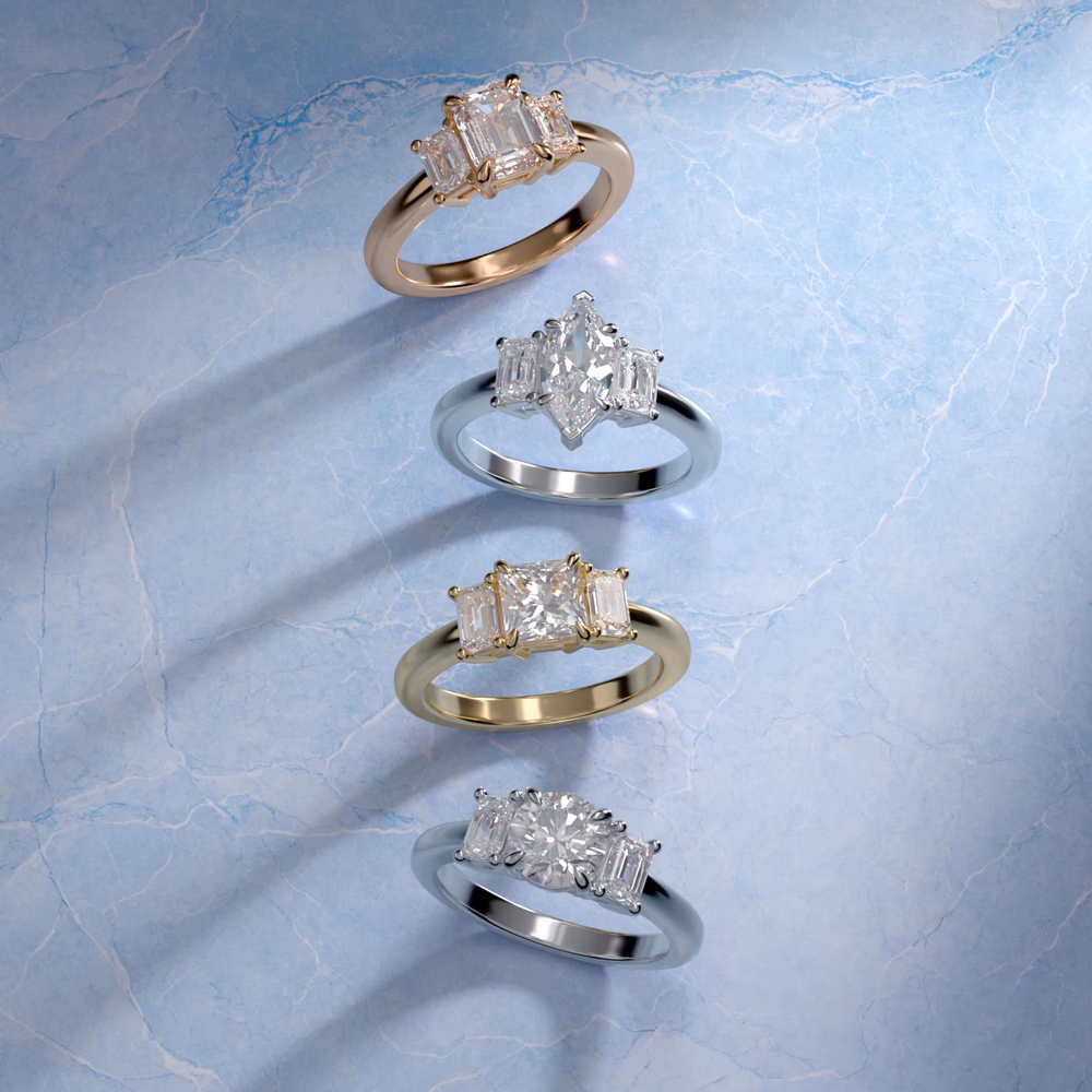 Petite Micropavé Trio Diamond Engagement Ring in 14K White Gold — princess cut center with micropavé round side stones, the most affordable three-stone option on Blue Nile