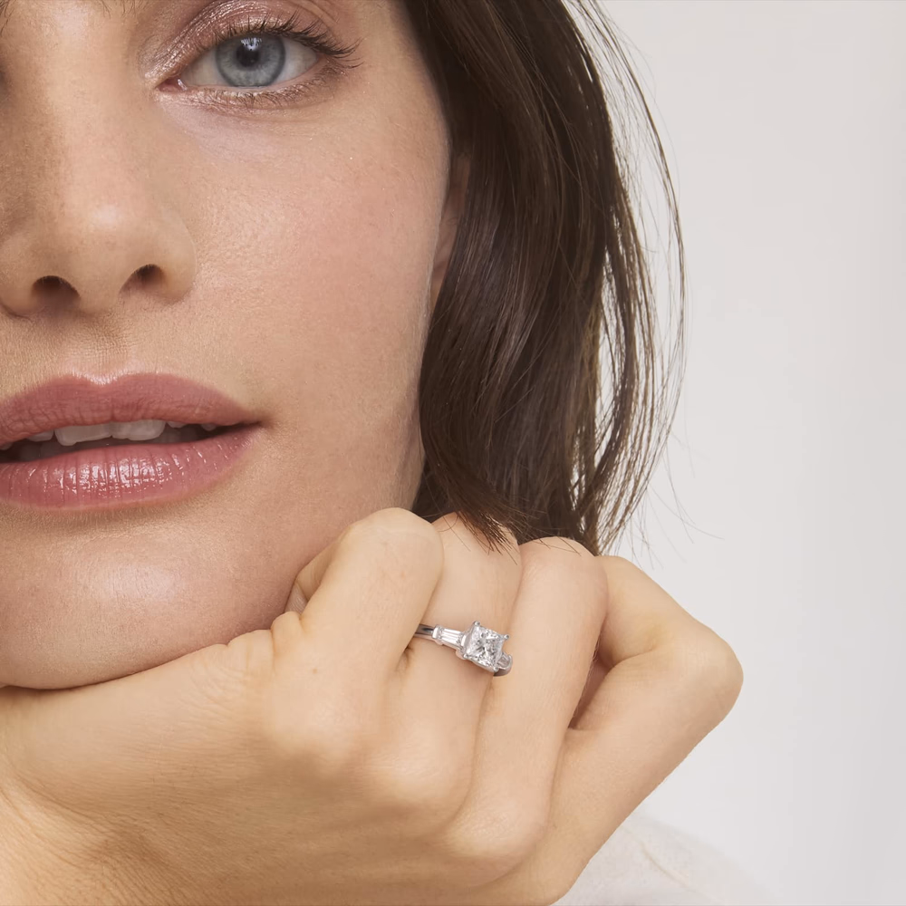 Cross Prong Pavé Set Surprise Diamond Engagement Ring in 14K White Gold — X-prong head with surprise pavé diamonds hidden in prong arms, princess cut center, white gold construction blends prongs with diamond brilliance